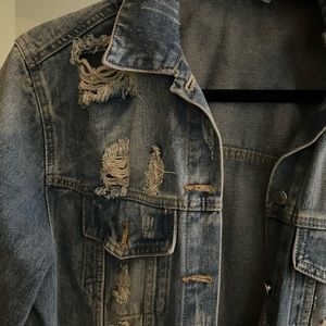 ripped blue jean jacket